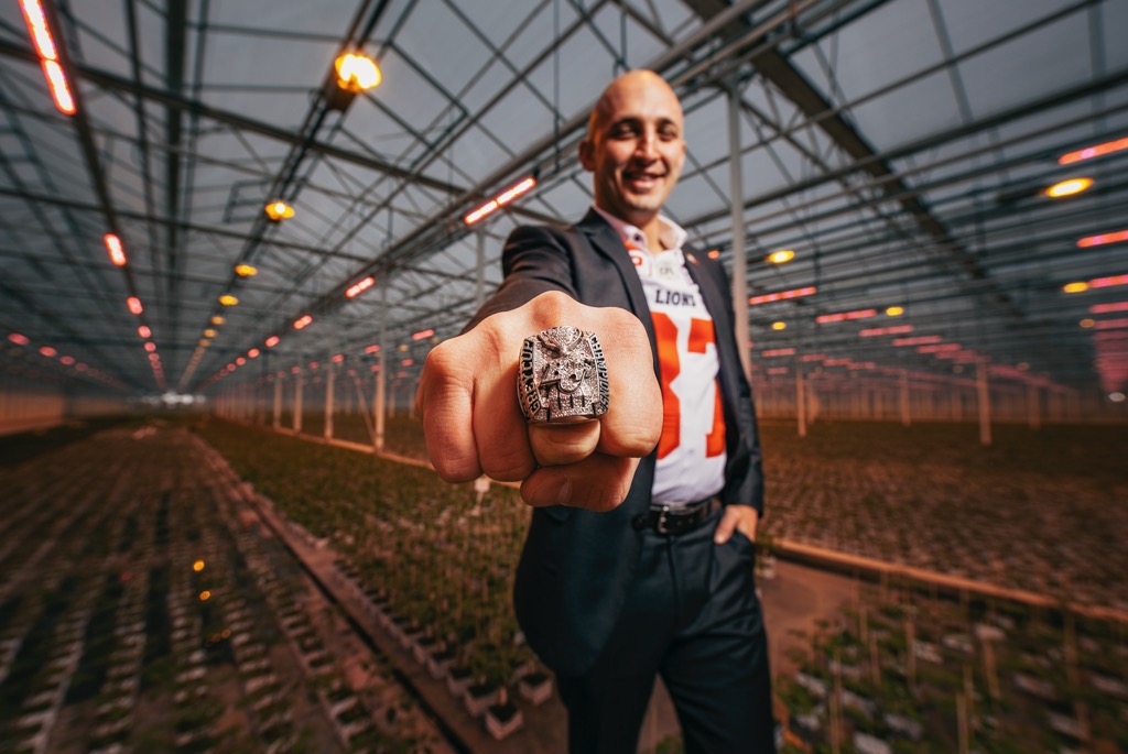 Marco Iannuzzi in a greenhouse among growing plants